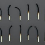 white candles on black holder