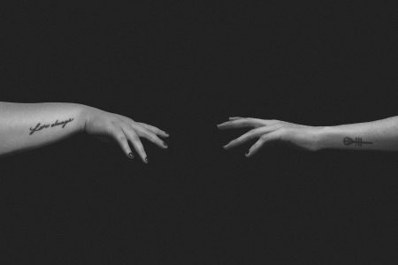 grayscale photo of persons hand